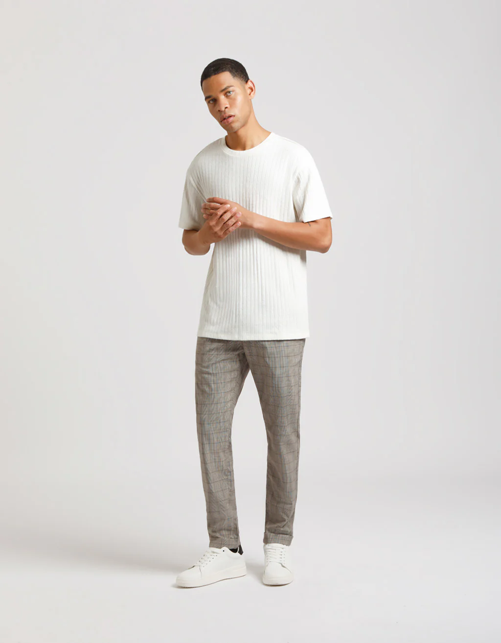 Pantaloni chino con fantasia a quadri